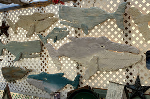 Large hand carved wooden whales