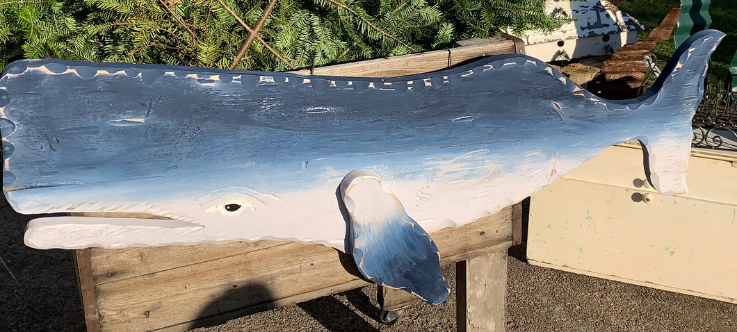 Large hand carved wooden whales